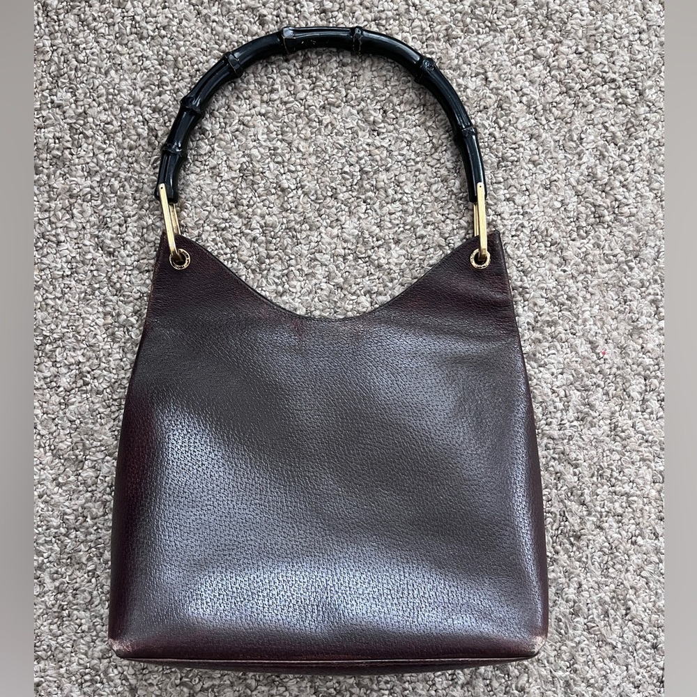 Vintage rustic Gucci leather bag with brown pouch and black bamboo handle gold